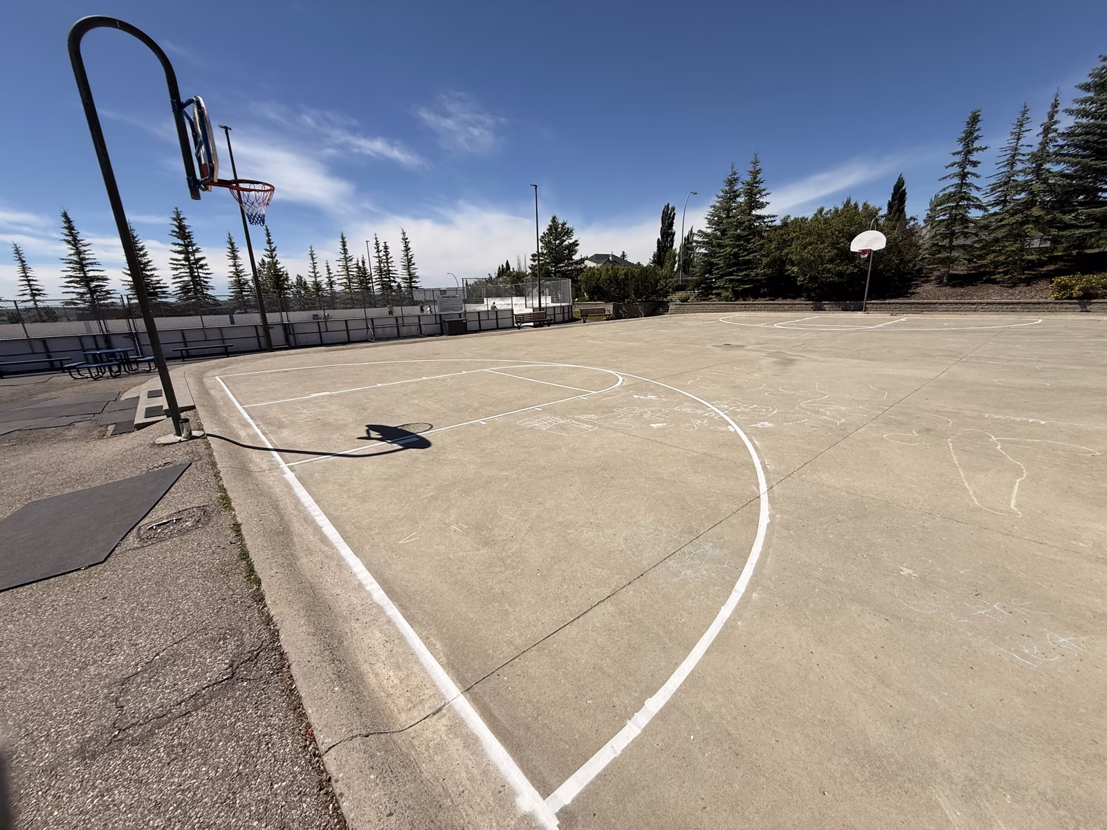 Wide view of the finished court, crisp lines running the full length